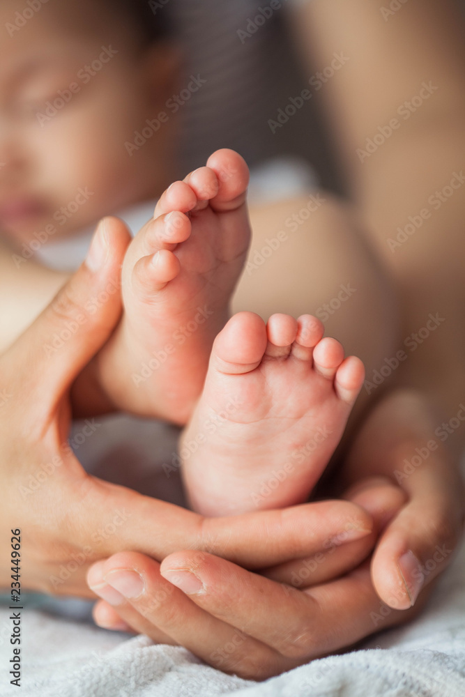 Close up of newborn baby feet. Baby's feet in the mother hands. Baby. Cozy. Love. Family. Close up of newborn baby feet. Baby's feet in the mother hands. Baby. Cozy. Love. Family.