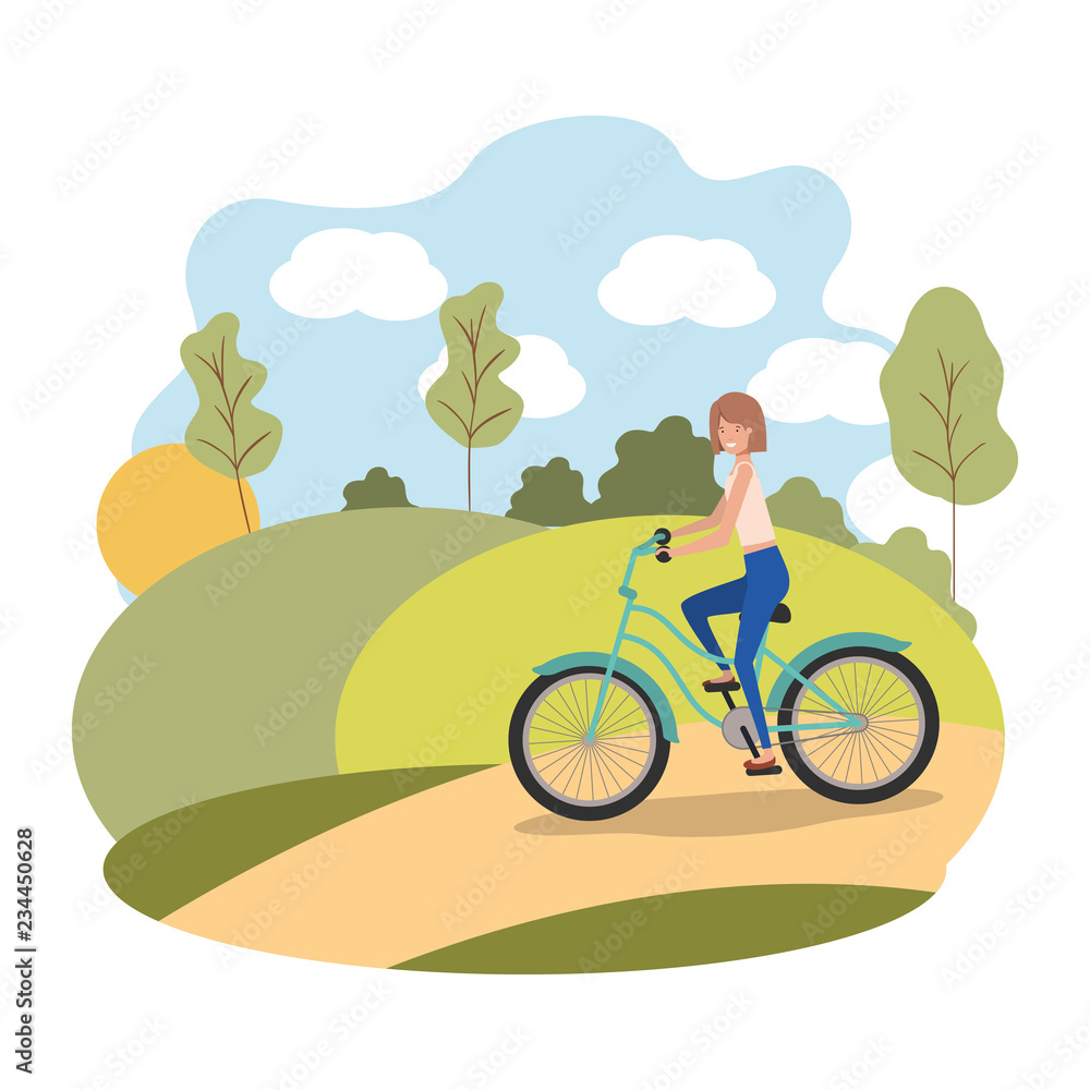 Naklejka premium young woman in bicycle on the park