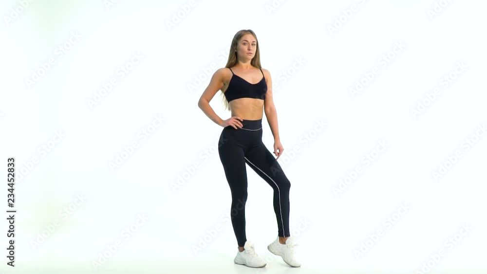 Fit sporty model in sportswear striking a pose in the studio Fit sporty model in sportswear striking a pose in the studio