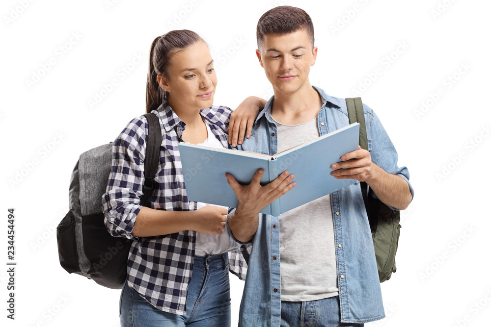 Male and female student reading a book Male and female student reading a book
