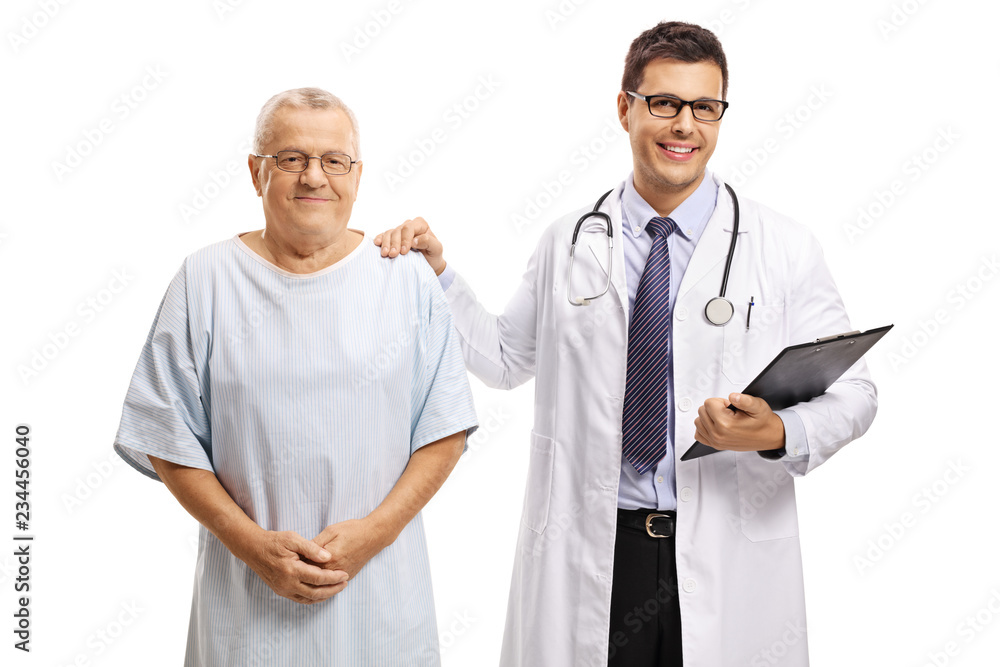 Young male doctor standing with an elderly male patient and looking at the camera