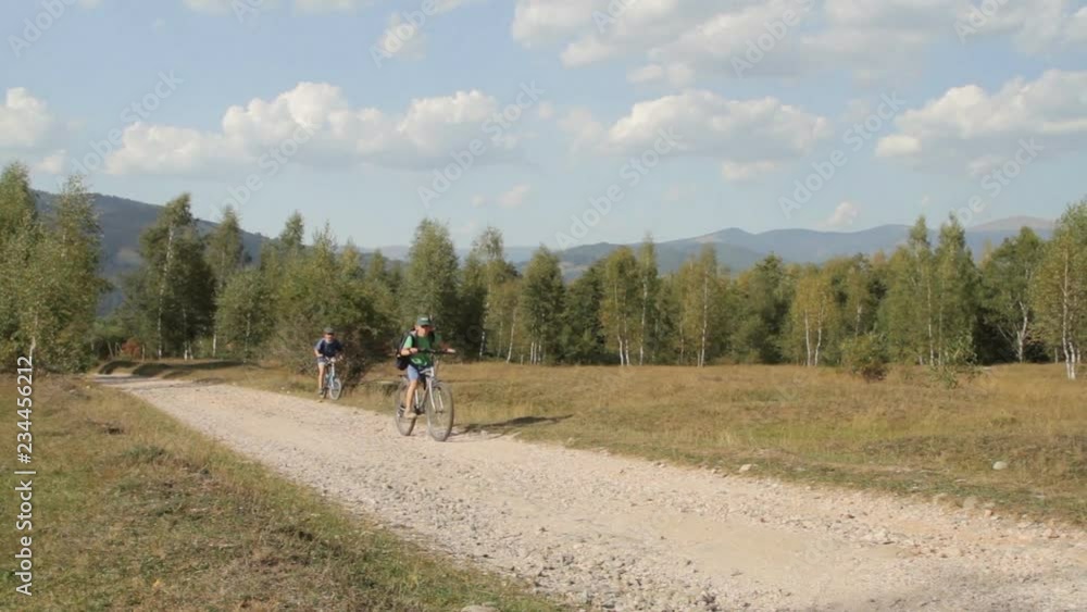 Two young boys on bicycles at the countryside. Two young boys on bicycles at the countryside.