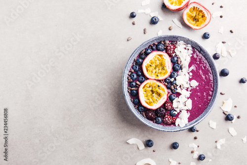 Smoothie acai bowl served in bowl on grey table photo