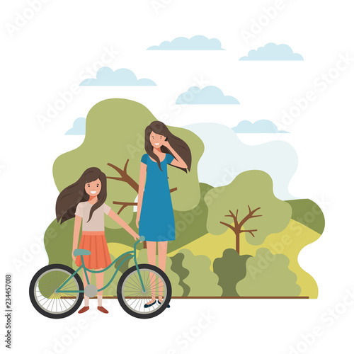 mother and daughter with bicycle in landscape