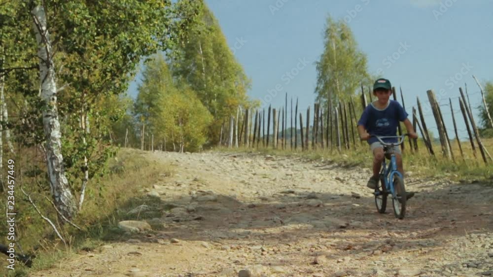 Young boy on bicycles at the countryside. Young boy on bicycles at the countryside.