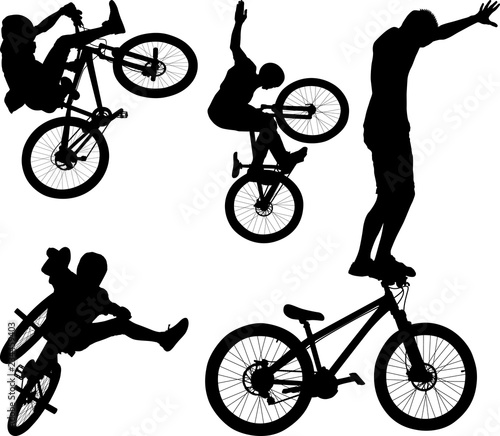 silhouette of male doing bike trick