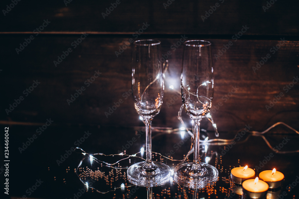glasses with champagne and candle - romantic evening glasses with champagne and candle - romantic evening
