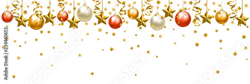 Christmas baubles and golden serpentine streamers.