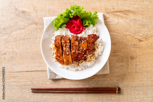 grilled chicken with teriyaki sauce on topped rice