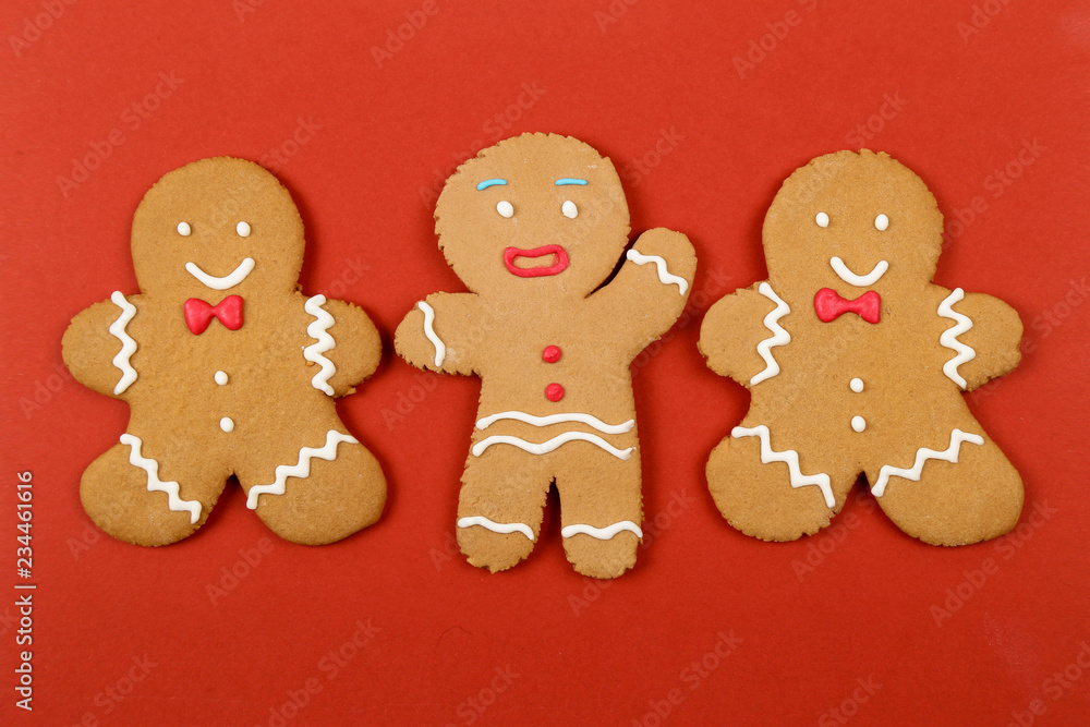 Christmas cookies, gingerbread In the form of a man on red background. Christmas background Christmas cookies, gingerbread In the form of a man on red background. Christmas background