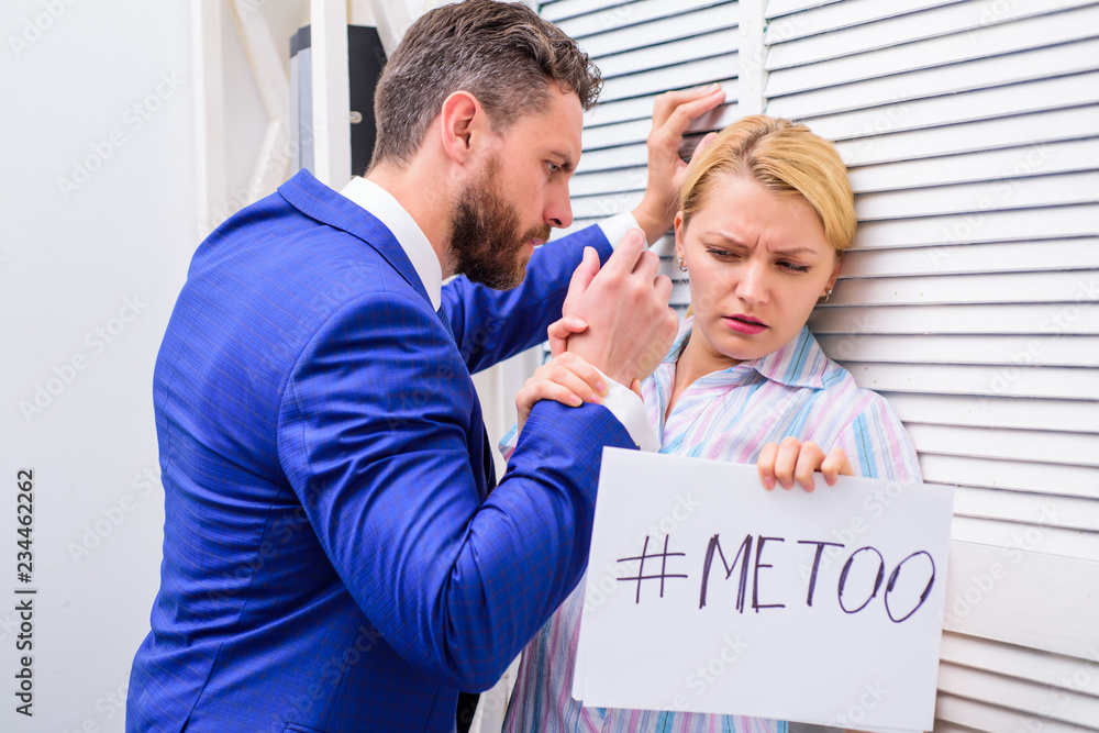 Obraz premium Woman showing a note with the text me too. Touch knee. Movement against sexual harassment. Sexual harassment at work.