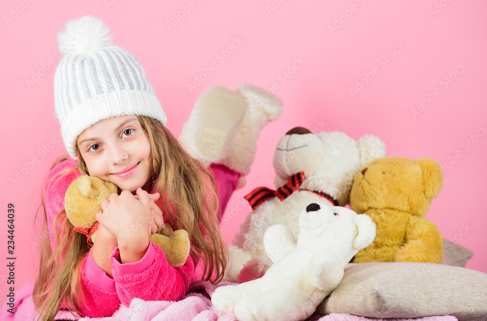 Child small girl playful hold teddy bear plush toy. Bears toys collection. Kid little girl play with soft toy teddy bear pink background. Teddy bears improve psychological wellbeing. Softness is key