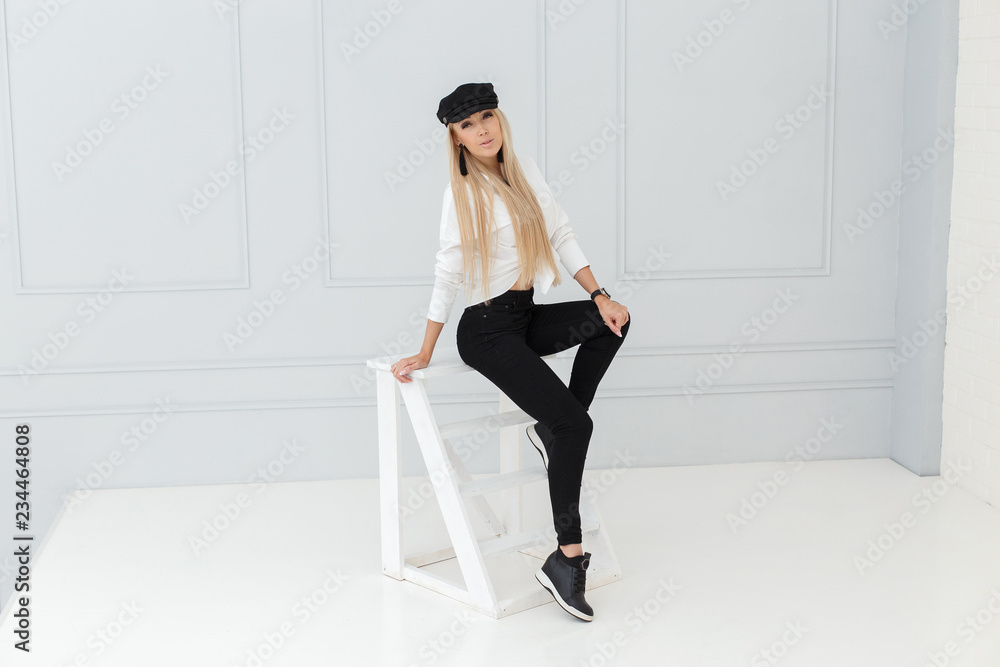Fashion portrait of women in black and white suit Fashion portrait of women in black and white suit