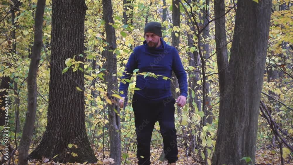Bearded man in the forest with an ax slowing down. Forester chopping trees in the forest. Slow motion.
Bearded man in the forest with an ax slowing down. Forester chopping trees in the forest. Slow motion.