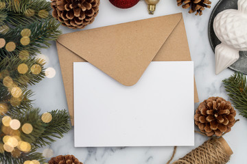 Blank white christmas card composition. Fir branch, festive seasonal decorations, lay flat background template