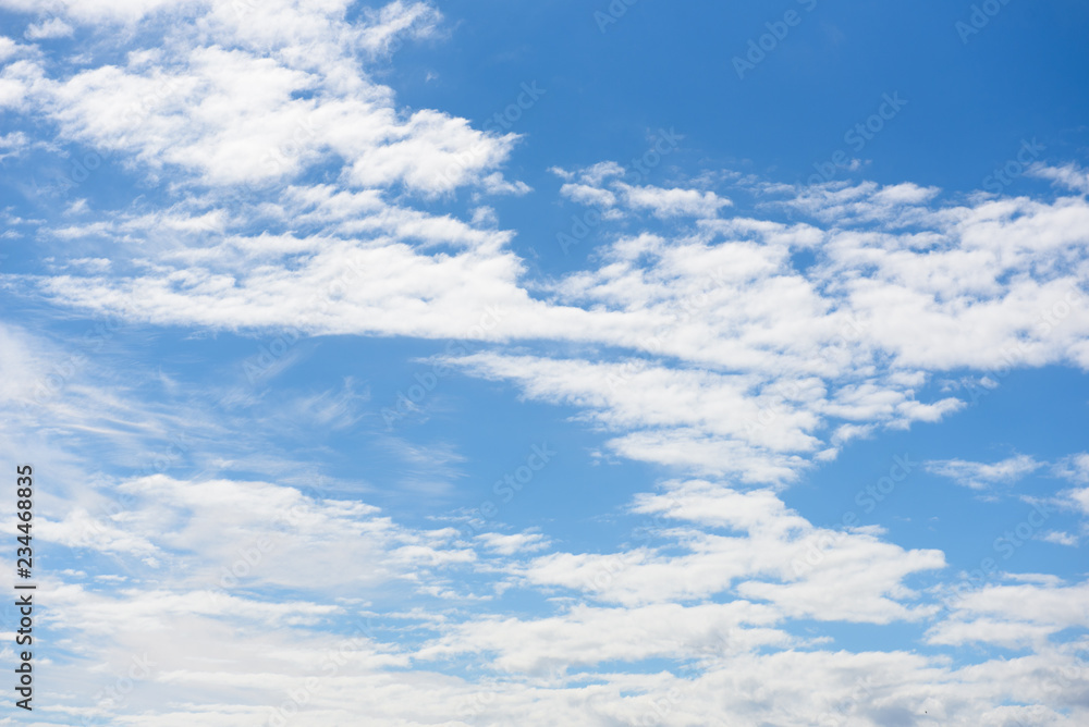 Fluffy white clouds in blue sky background Fluffy white clouds in blue sky background