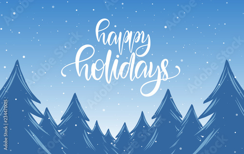 Handwritten calligraphic lettering of Happy Holidays on blue winter Christmas background with snowy pine forest