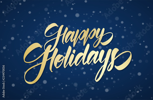Golden handwritten calligraphic brush lettering of Happy Holidays on winter snowy sky background with snowflakes