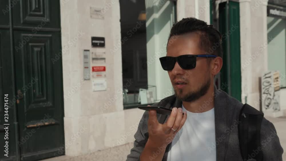 Attractive young caucasian tourist student man having fun happy and excited taking voice recognition speech ai audio message. Travel,vacation, holidays in European city concept. Attractive young caucasian tourist student man having fun happy and excited taking voice recognition speech ai audio message. Travel,vacation, holidays in European city concept.
