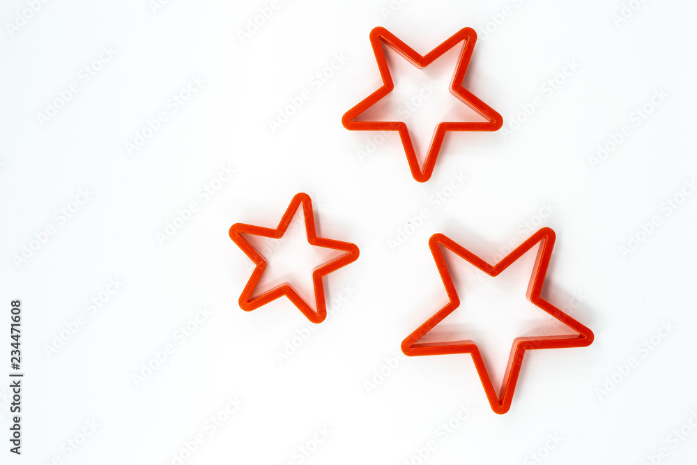 Fototapeta premium Cookie cutter star shape on white background