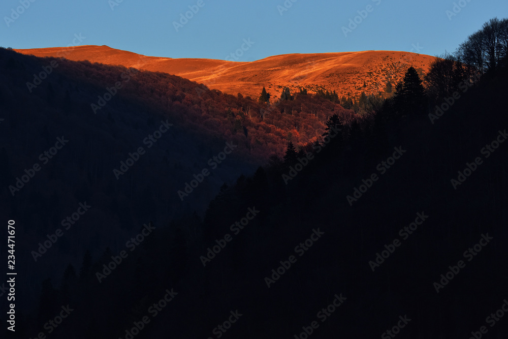 Nature background. Sunset in Bucegi mountains seen from Prahova Valley, Sinaia resort, Romania
