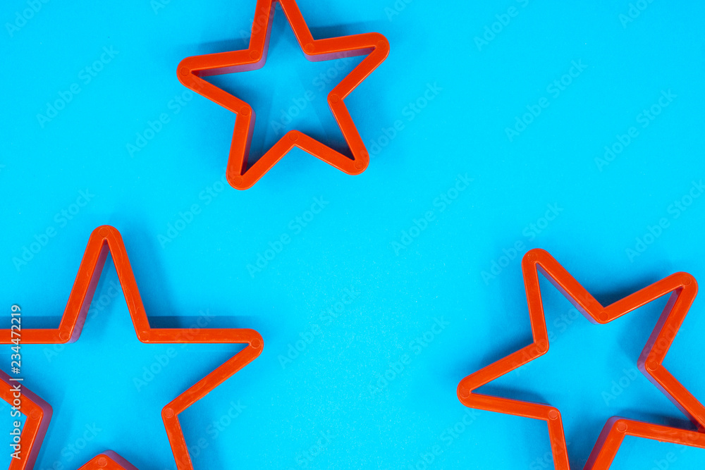 Cookie cutter star shape on blue background Cookie cutter star shape on blue background