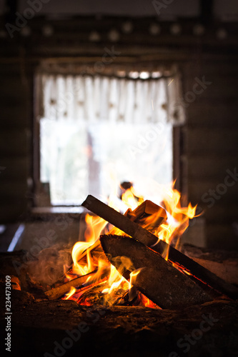 fire burns in the fireplace