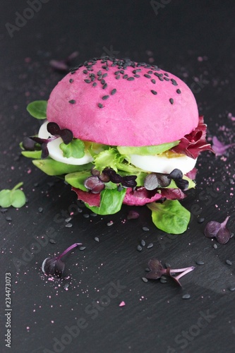 Pink burger with avocado and egg photo