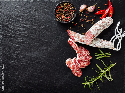 Fotografie fuet sausage cut in slices, flatlay