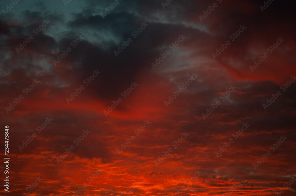 Bright sunset sky with clouds background