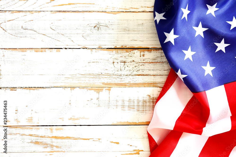 Patriotic composition w/ ruffled American flag on black background ...