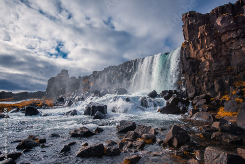 majestic waterfall  Oxararfoss in Thingvellir National Park Iceland in autumn in sunny weather