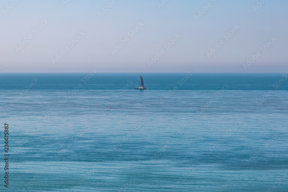 A Sailing Boat on a Calm Ocean on a Sunny Day