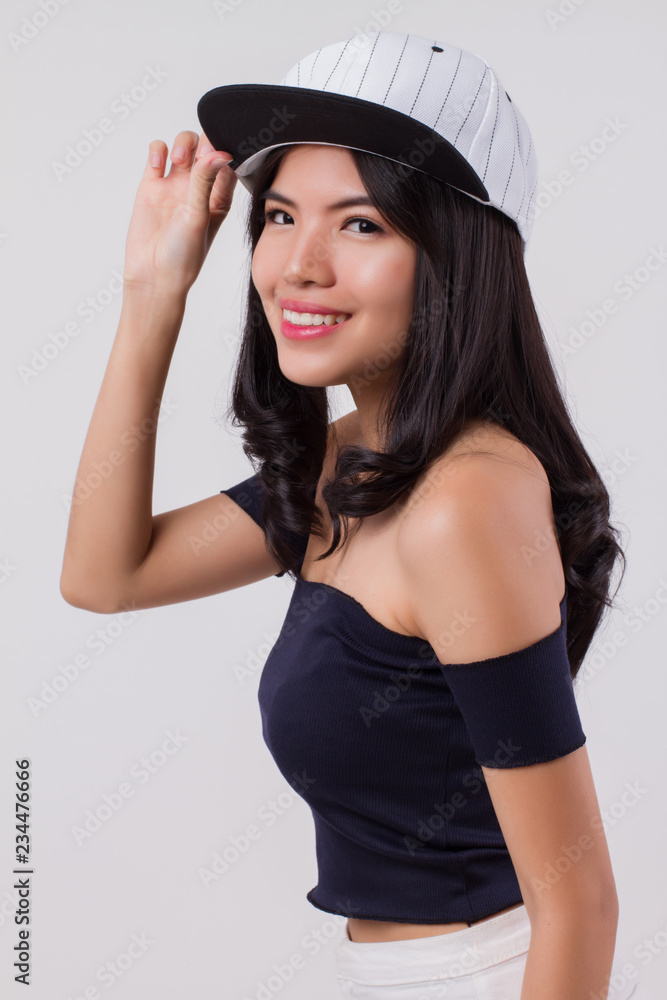 cute happy smiling woman wearing cap. portrait of positive optimistic urban woman with modern fashion, studio white isolated with friendly girl face. young adult beautiful girl asian woman model cute happy smiling woman wearing cap. portrait of positive optimistic urban woman with modern fashion, studio white isolated with friendly girl face. young adult beautiful girl asian woman model