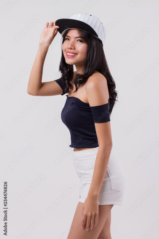 cute happy smiling woman wearing cap. portrait of positive optimistic urban woman with modern fashion, studio white isolated with friendly girl face. young adult beautiful girl asian woman model cute happy smiling woman wearing cap. portrait of positive optimistic urban woman with modern fashion, studio white isolated with friendly girl face. young adult beautiful girl asian woman model
