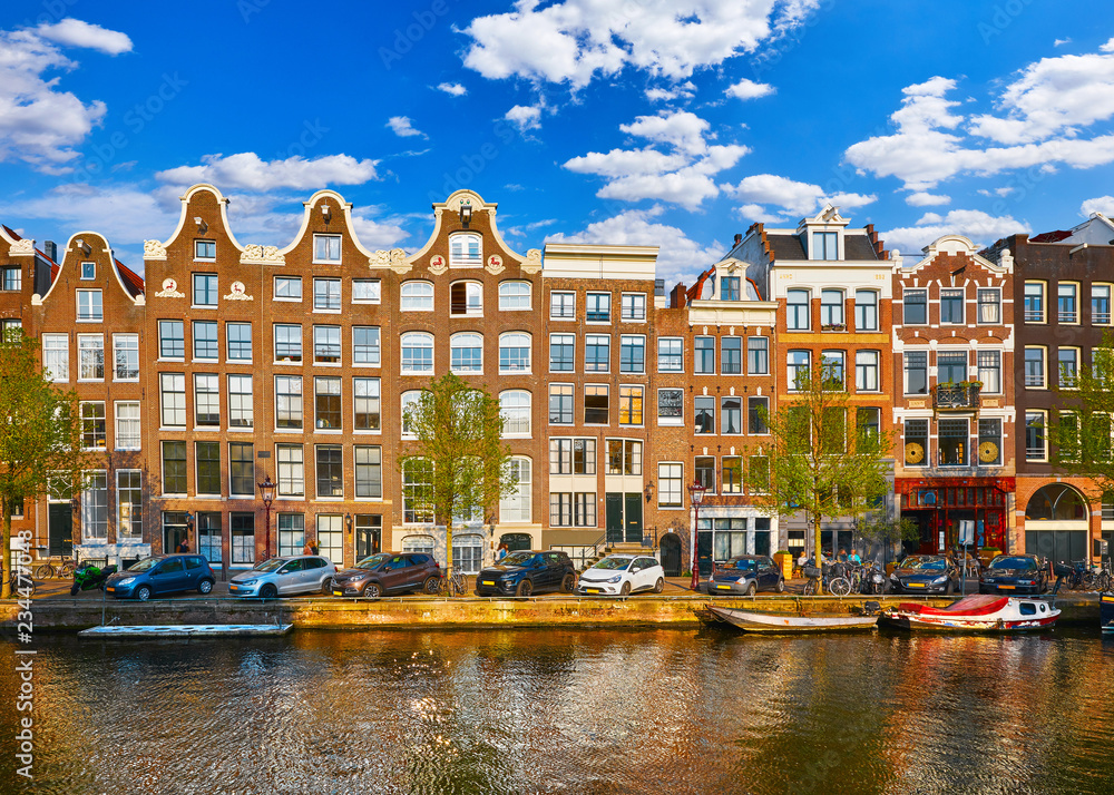 Amsterdam Netherlands. Traditional brown house at coast channel