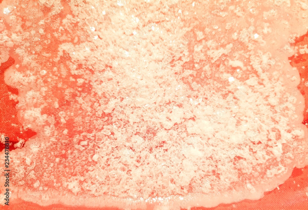 Fototapeta premium Salt granules on pink backgound