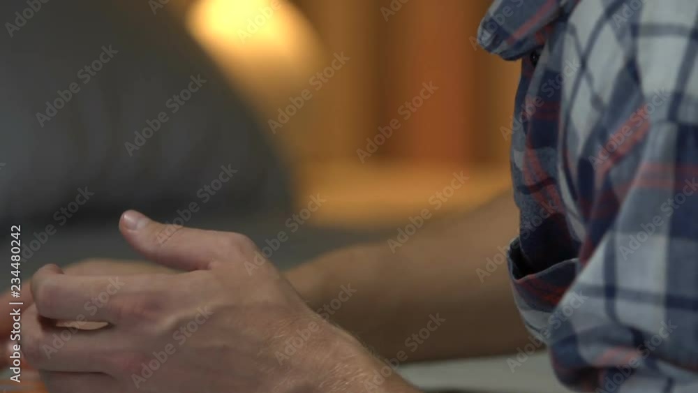 Male holding family portrait, thinking about break-up and crying, depression Male holding family portrait, thinking about break-up and crying, depression