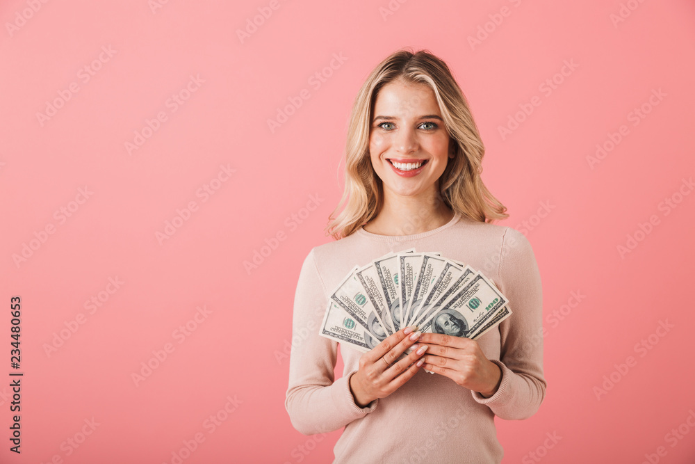 Portrait of a happy young woman wearing sweater Portrait of a happy young woman wearing sweater