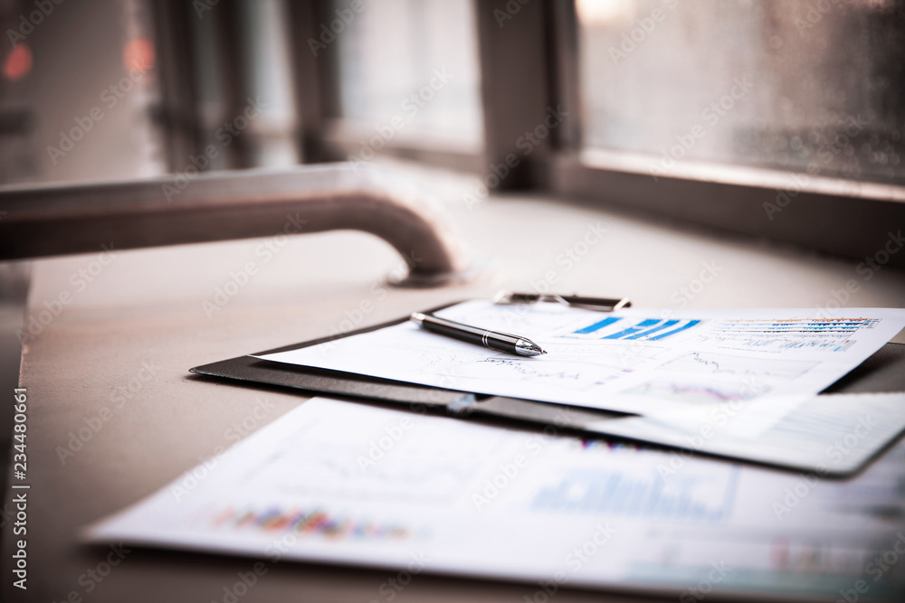 Fototapeta premium Drawings and charts of successful business, workplace of the businessman
