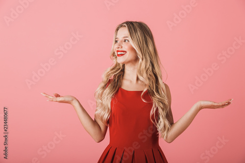 Portrait of a smiling young woman in red dress