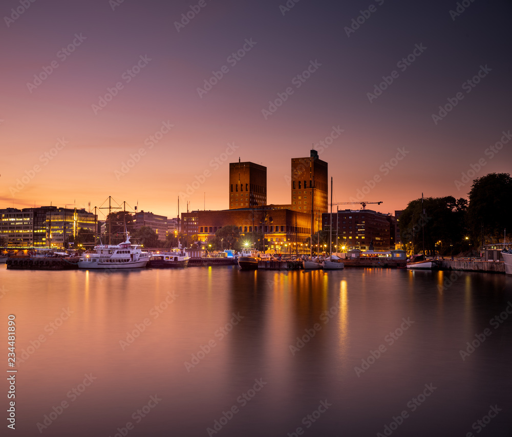 Oslo City Hall and harbour after sunset.