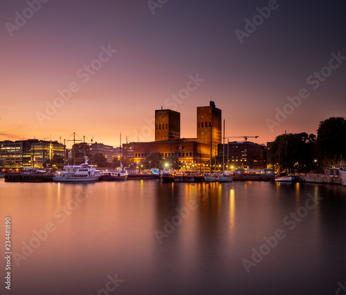 Oslo City Hall and harbour after sunset.