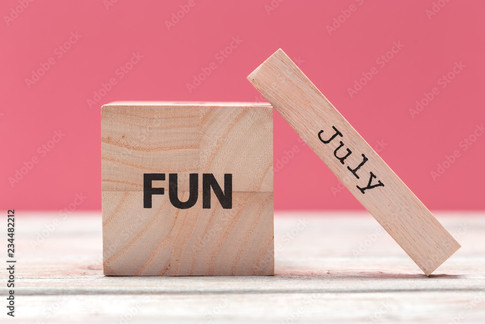 Wooden cubes with text on table over pink background with copy space for text Wooden cubes with text on table over pink background with copy space for text