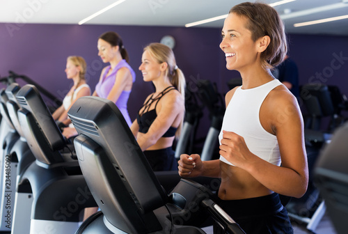 Women running on treadmills