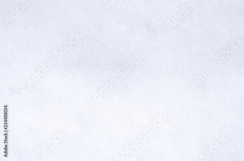 Background of fresh white snow sparkling in the sun texture. Copyspace for text.