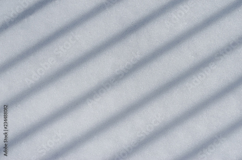 Background of fresh white snow sparkling in the sun texture. Copyspace for text.