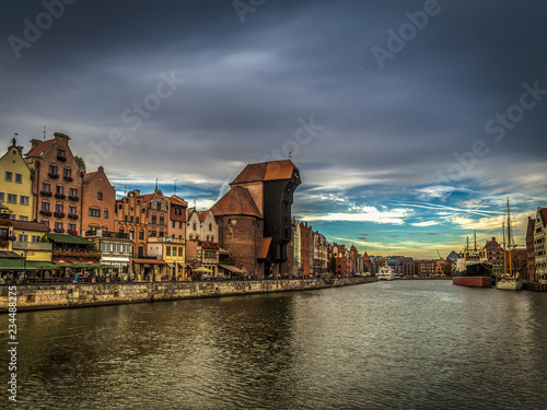 Famous medieval crane in the Gdansk , Poland in the evening with scenic dark blue cloudy sky