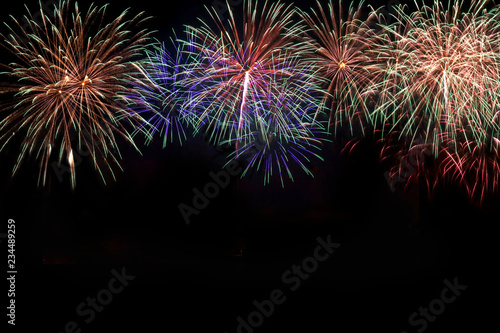 Colorful of fireworks in holiday new year festival on black sky.