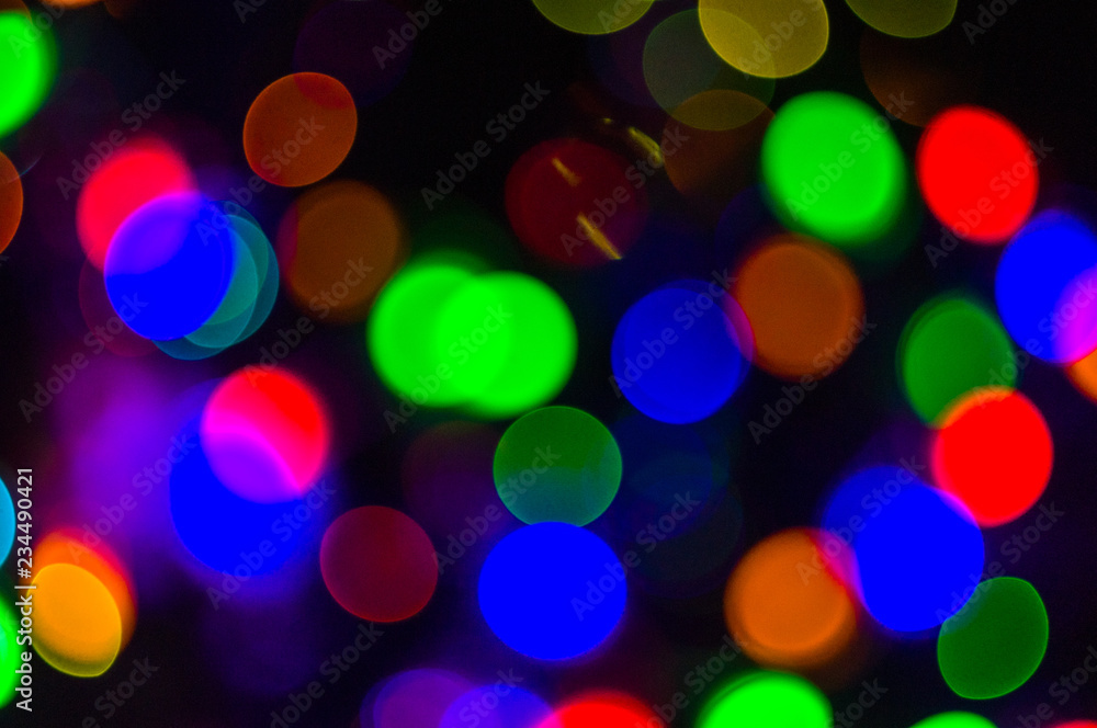 Christmas background-garlands with colorful lights on a decorated Christmas tree, bokeh Christmas background-garlands with colorful lights on a decorated Christmas tree, bokeh